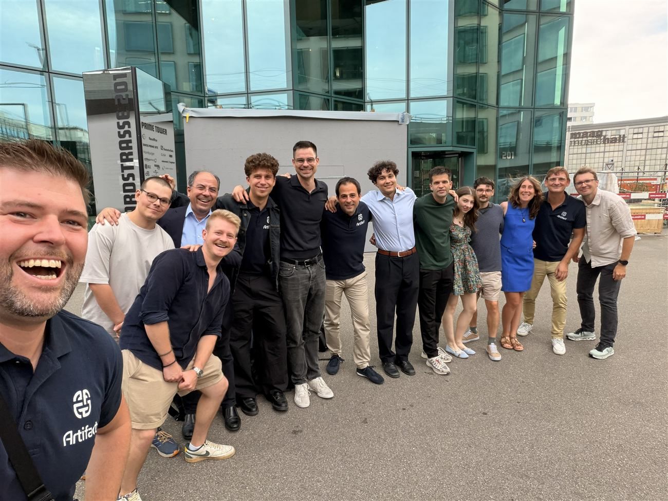 The whole Artifact team outside the Prime Tower in Zürich