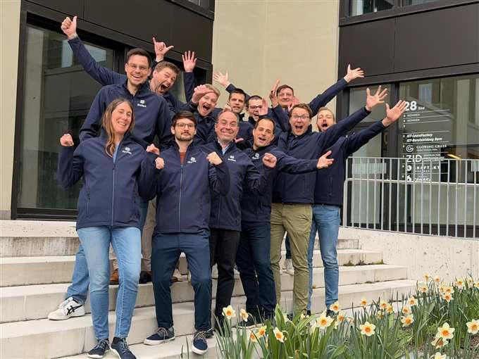 The Artifact team celebrating outdoors on a spring day
