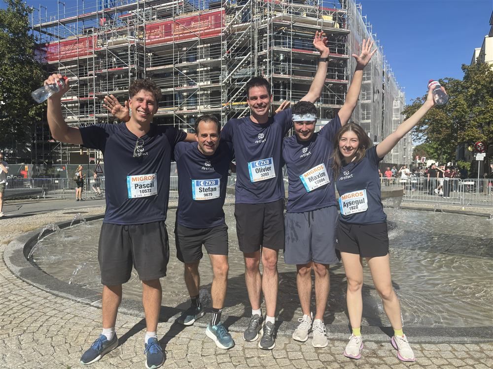 Five Artifact teammates celebrating after a city run